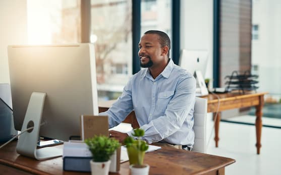 Man in front of a computer screen